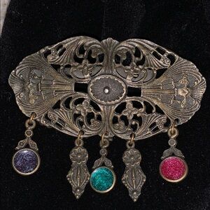 Gold and Purple Filigree Brooch with Intricate Design